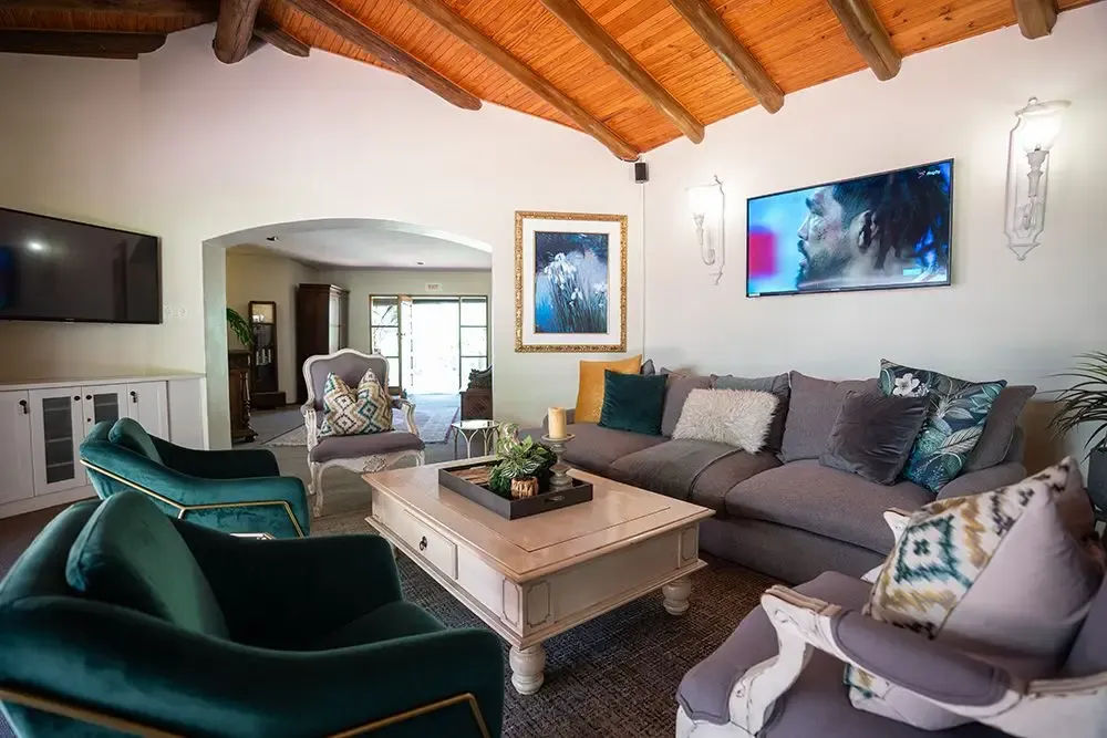Little Tuscany lounge with sofas and TV